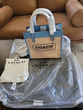 Brand New Coach Canvas Tote in Beige and Blue with Leather Trim.